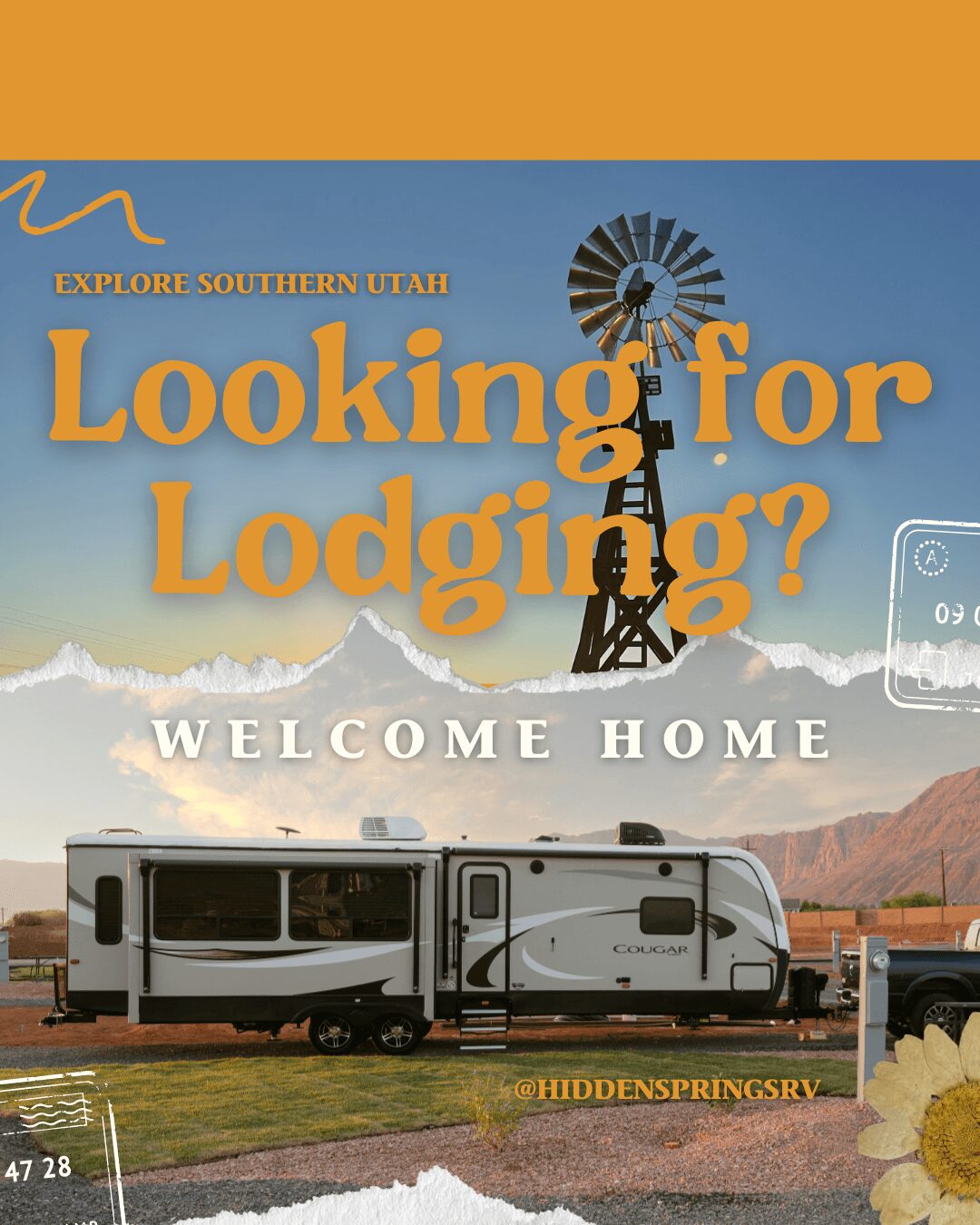 Travel trailer parked outdoors with mountains in background, blue sky, and a sunflower in foreground.
