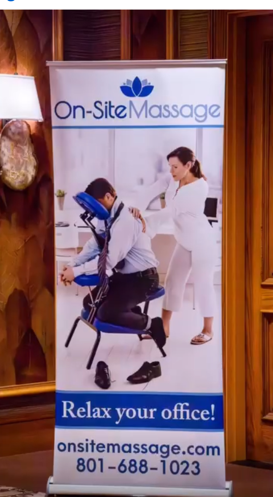 Person receiving massage from therapist in office setting with banner reading 'On-Site Massage' and contact details.