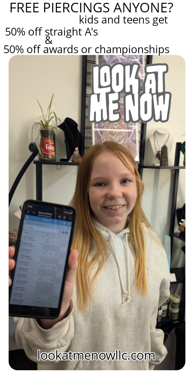 Girl smiling holding phone, poster behind with text about free piercings and discounts, shelves with items in background.