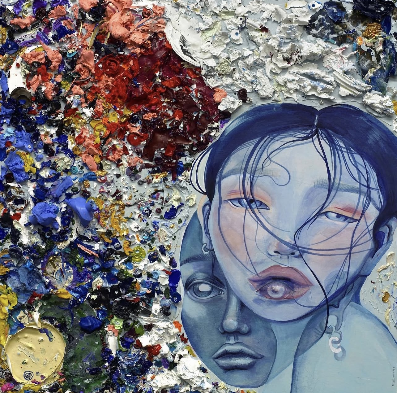 Mixed media artwork with a woman's face and abstract textured background, featuring blue tones and expressive brushstrokes.