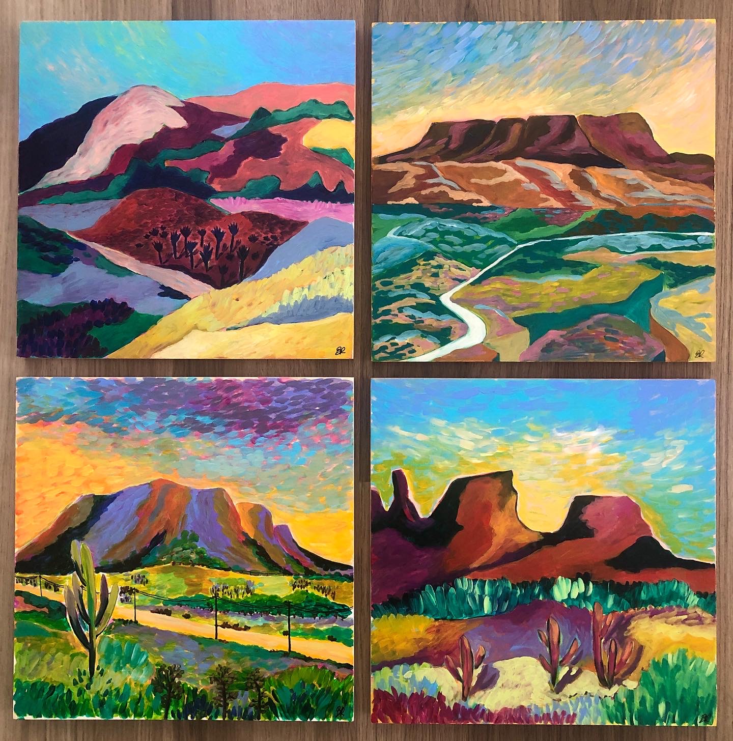 Four landscape paintings of mountains, valleys, and fields with vibrant colors and varied scenery.