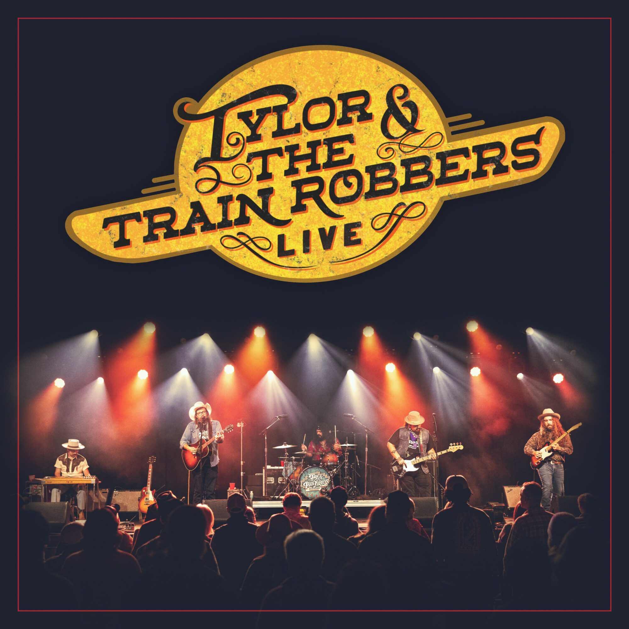 Band performs live on stage with colorful lights, audience watching, and a sign reading 'Tylor & The Train Robbers Live'.