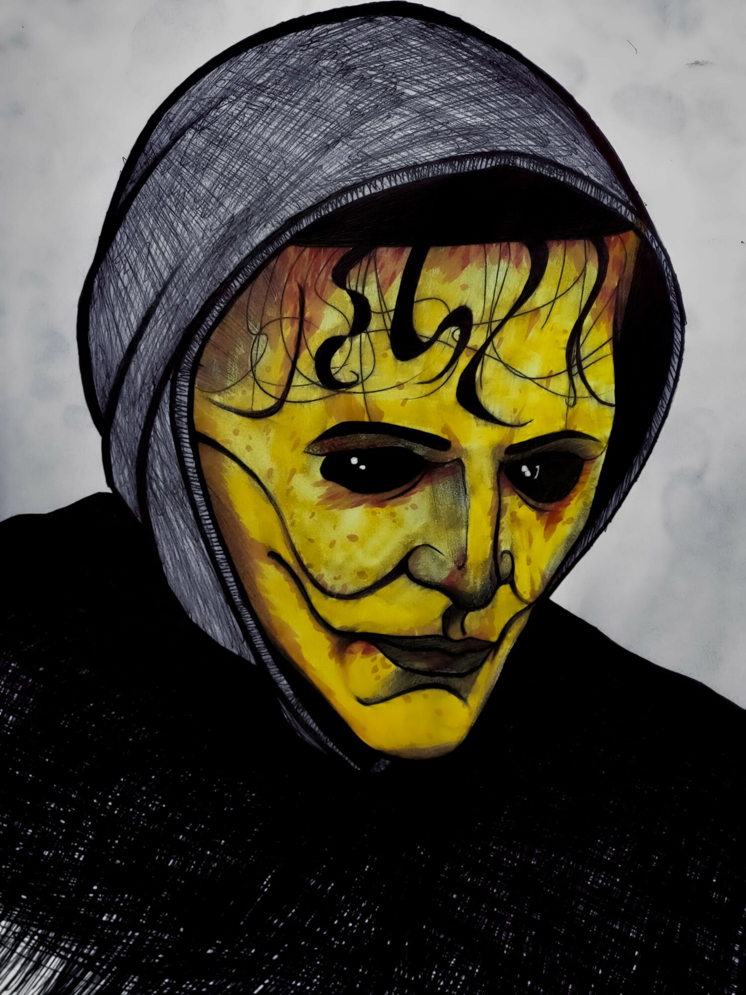 Person wearing a yellow mask with black designs, hooded in dark clothing, against a light background.