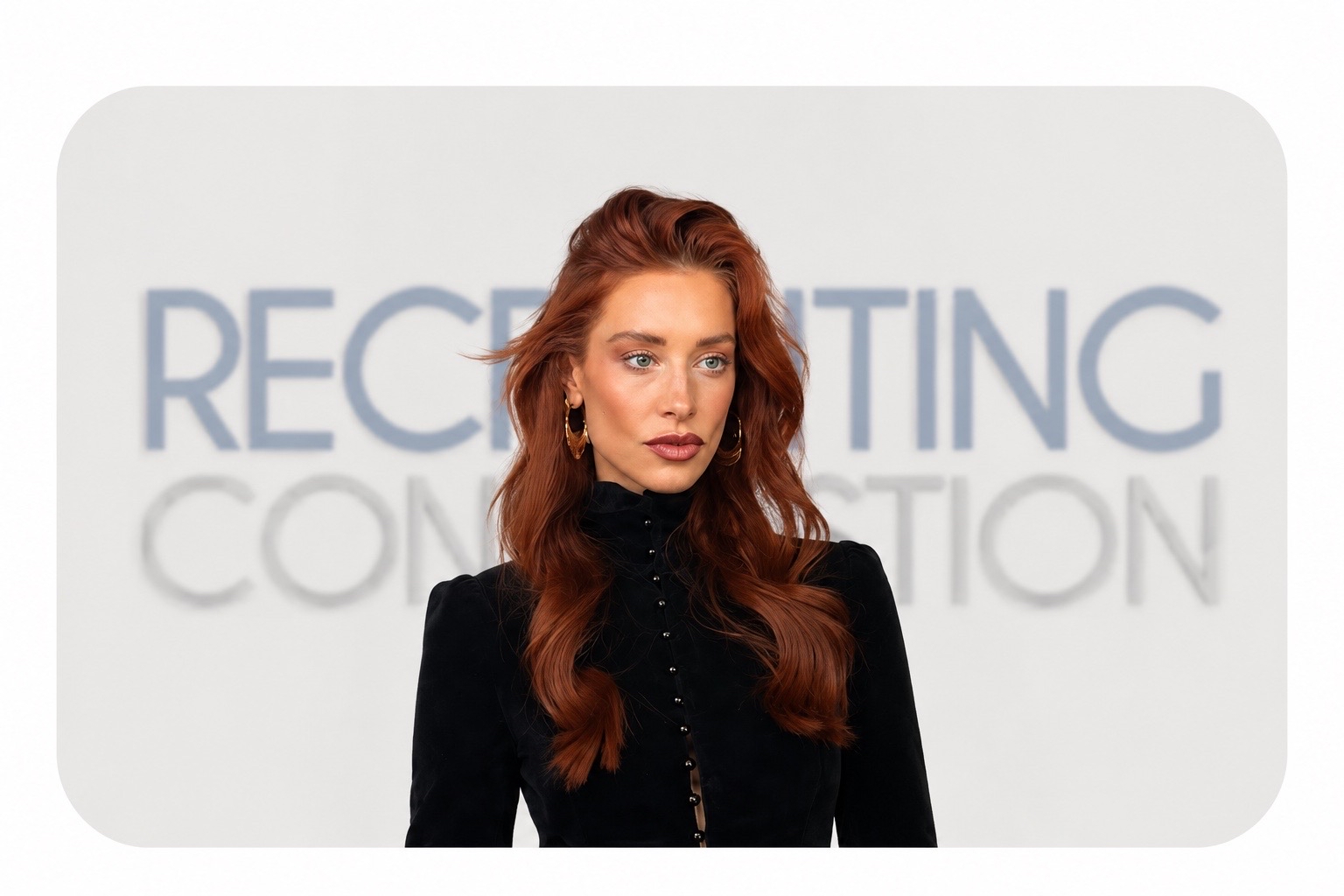 Woman with long red hair in a black outfit standing in front of a light background with text.