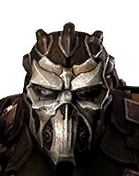 Close-up of a dark armored helmet with a metallic faceplate and raised horn-like details.